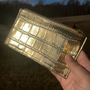 Estee Lauder cosmetic gold bag